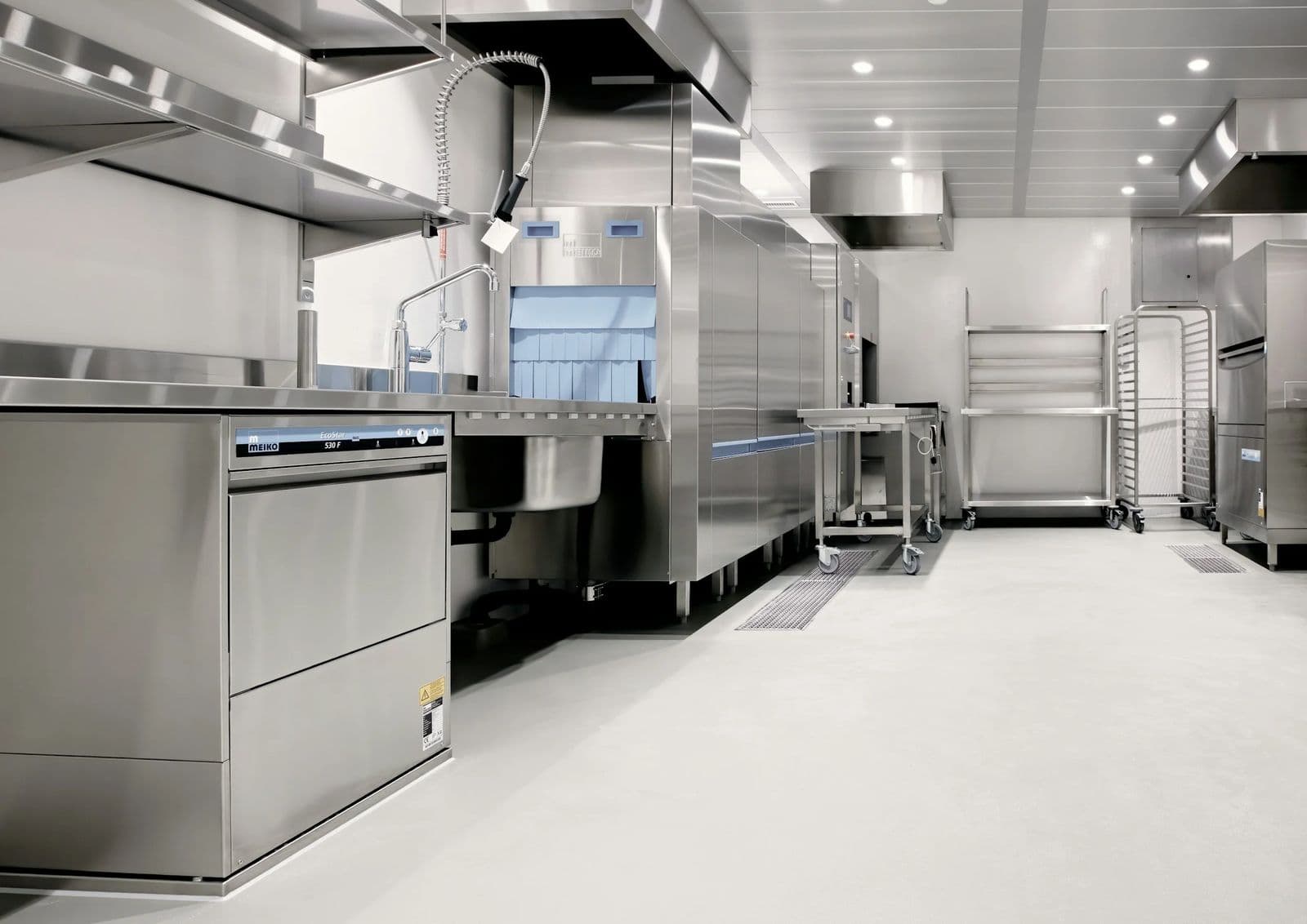 Bright commercial kitchen with a seamless coated floor